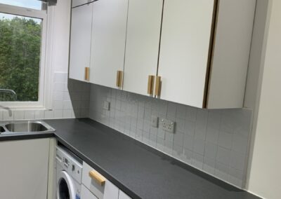 White laminate plywood kitchen, with plywood kitchen handles, kitchen refurbishment by The Life of Ply