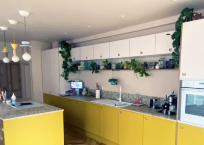 Plywood kitchen with yellow laminate kitchen doors and pink laminate kitchen doors by The Life of Ply